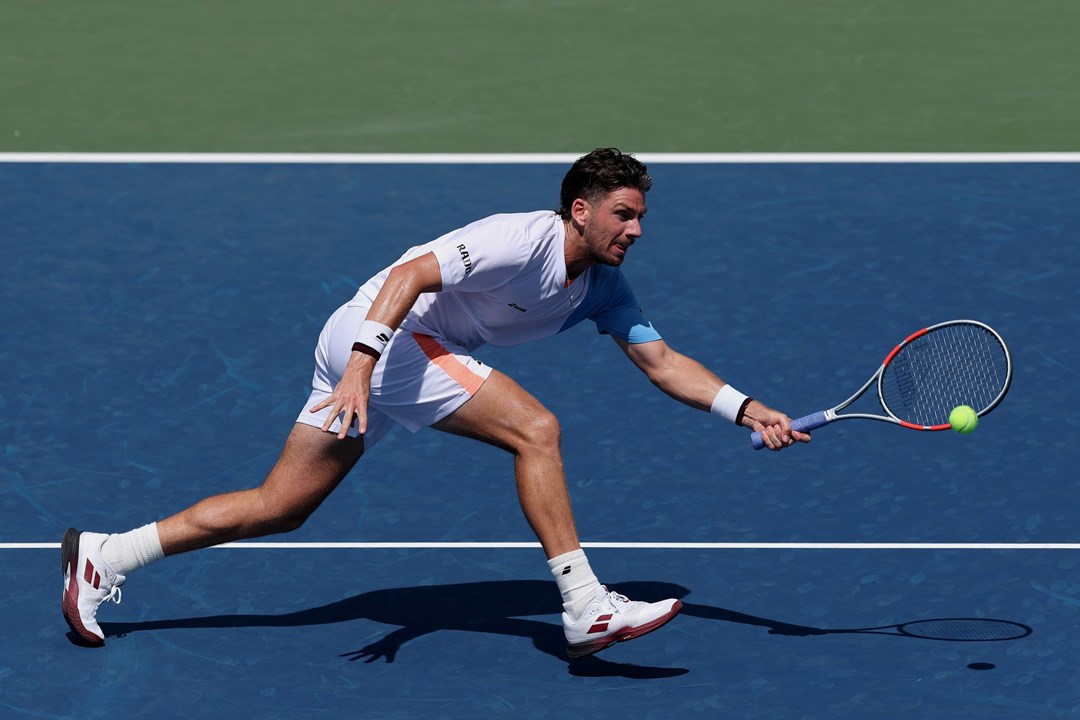 Cam Norrie stretches to hit a forehand in the first round of the 2025 US Open