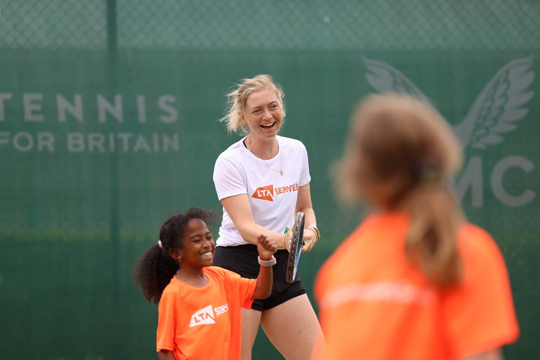 Alicia Barnett laughs while playing at an LTA SERVES event