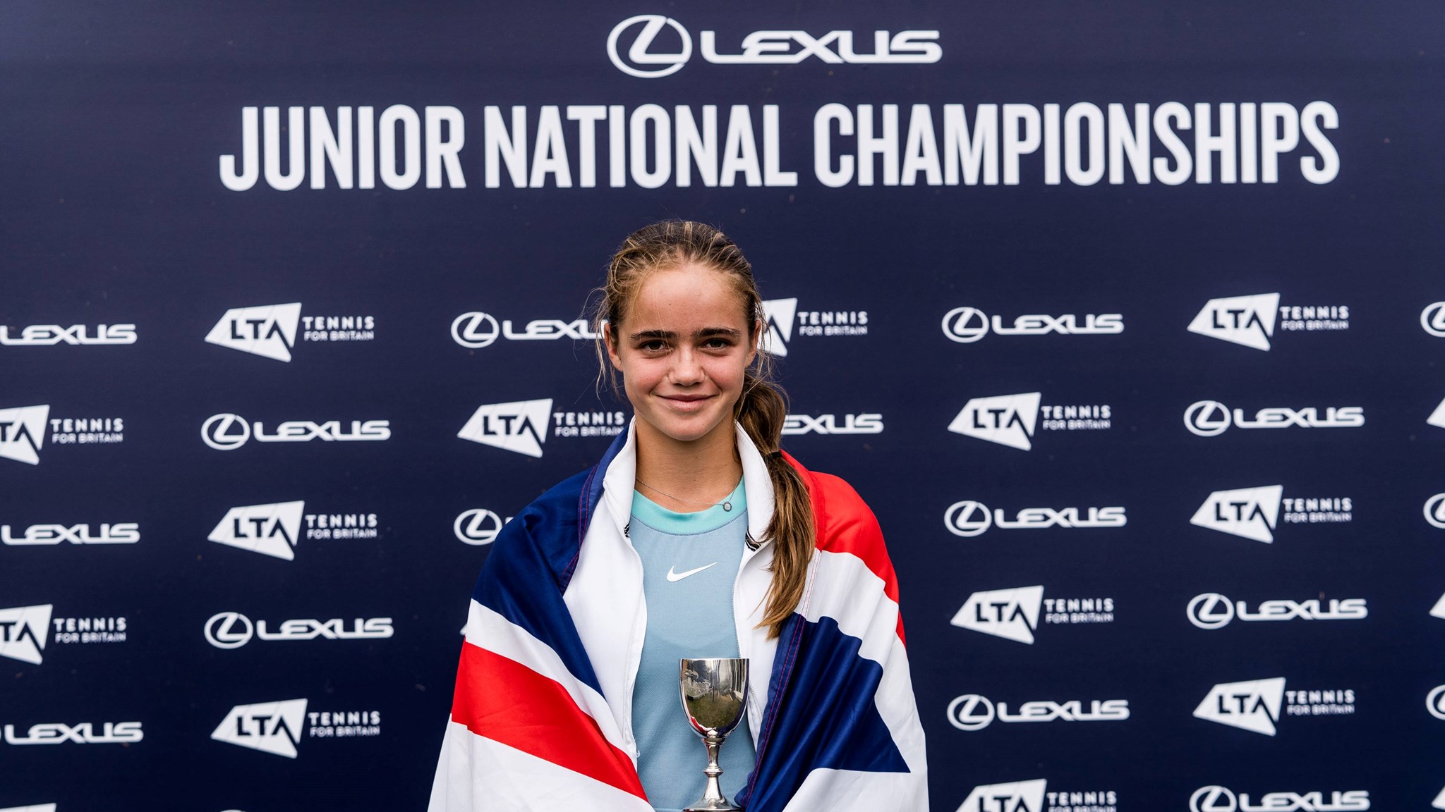 14U Lexus Junior National Champion Megan Knight holding the girls' singles title