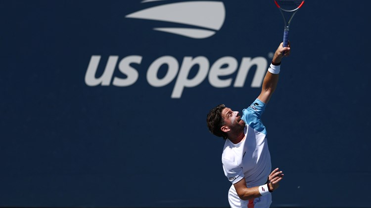 Cam Norrie hits a serve in the second round of the US Open 2025