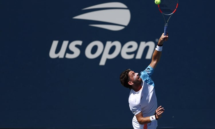 Cam Norrie hits a serve in the second round of the US Open 2025