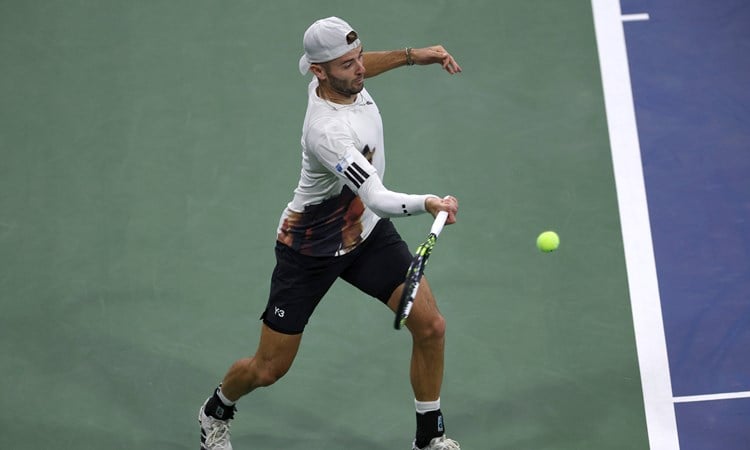 Jacob Fearnley strikes a forehand in the first round of the US Open 2025