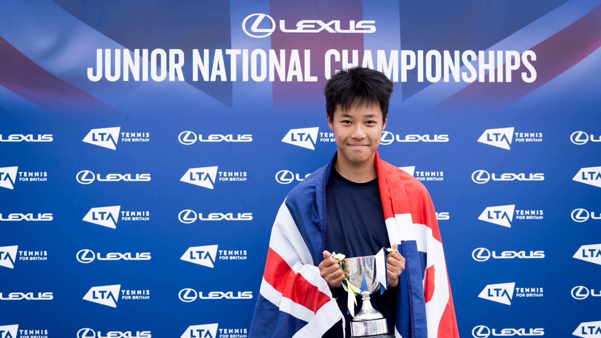 Ryan Szeto holding the 14U boys' singles trophy at the 2025 Lexus Junior National Championships