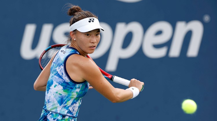 Lily Miyazaki preparing to hit a backhand slice on court at the US Open