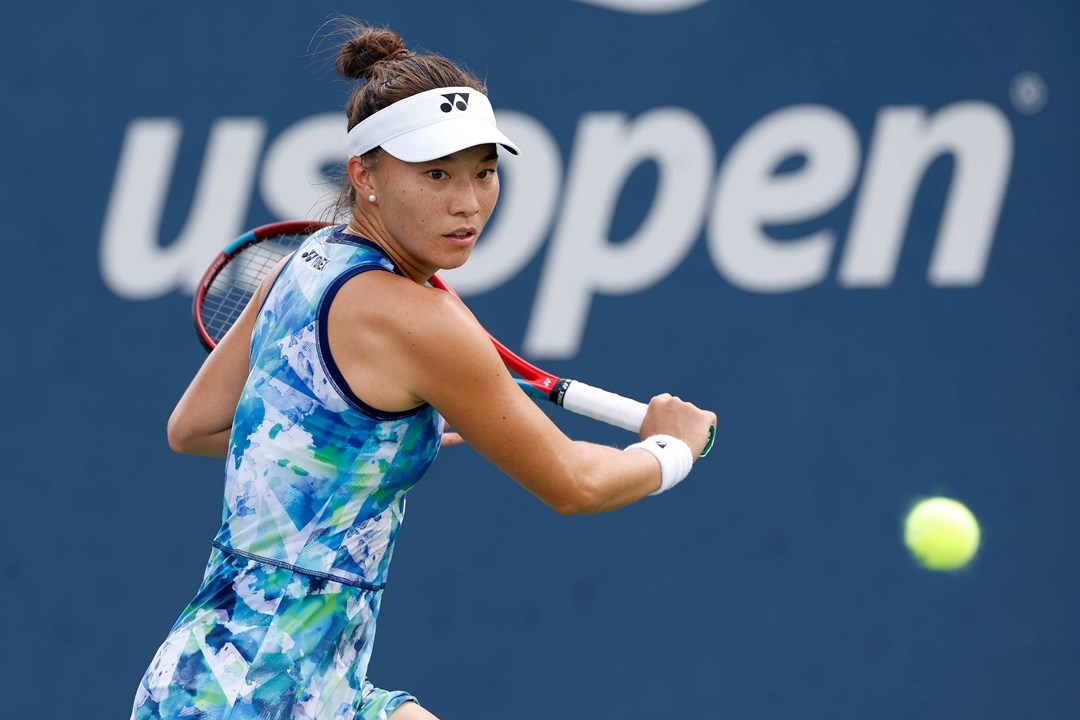 Lily Miyazaki preparing to hit a backhand slice on court at the US Open