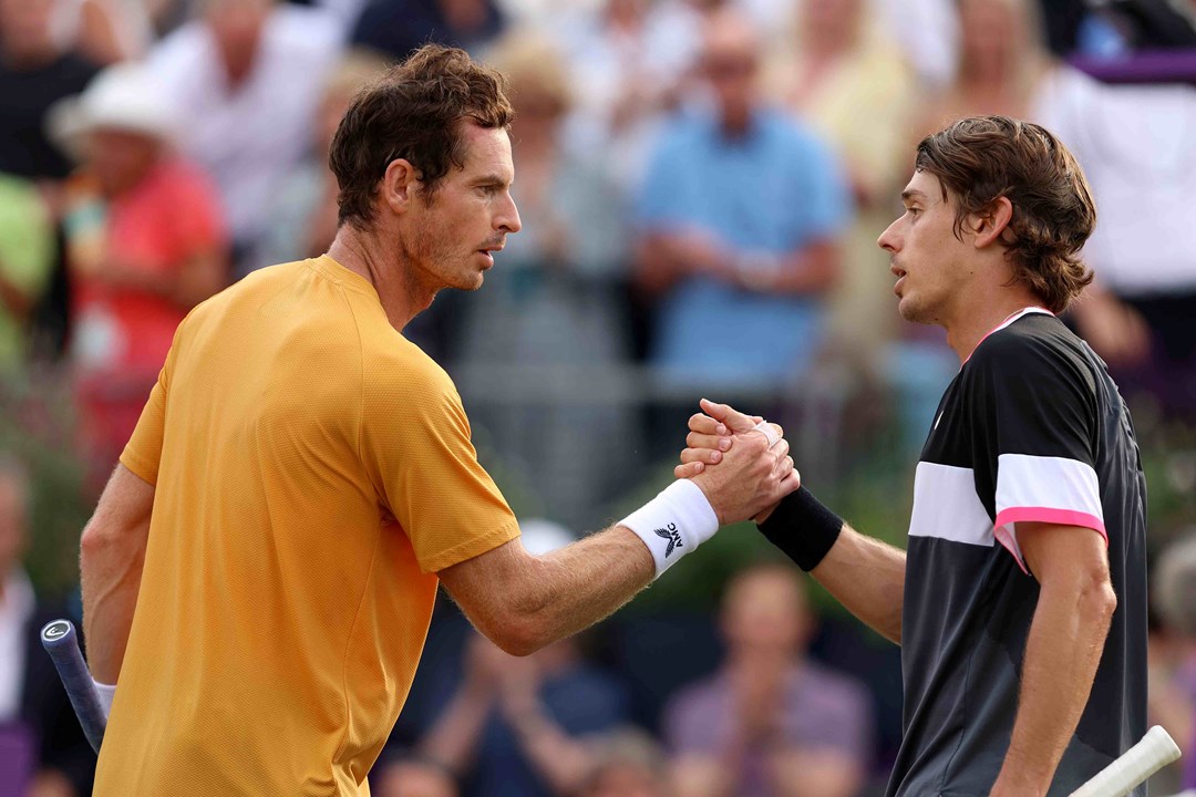 Andy Murray and Alex De Minaur shaking hands at their net on court after their Round 1 match at the cinch Championships