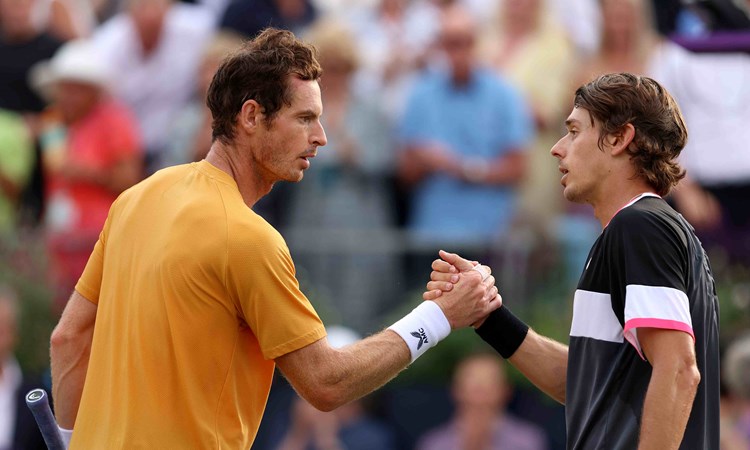 Andy Murray and Alex De Minaur shaking hands at their net on court after their Round 1 match at the cinch Championships