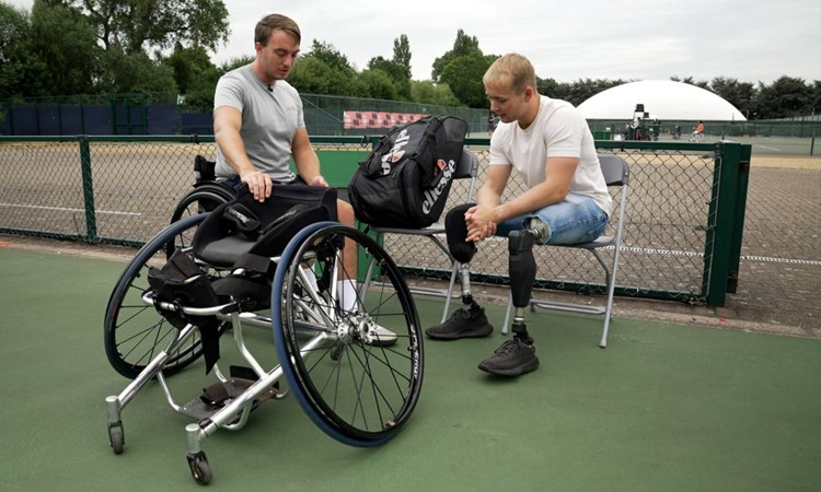 Billy Monger and Dermot Bailey chatting on court before a practice session