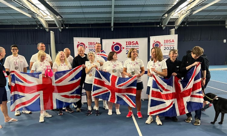 The GB visually impaired tennis team photographed together holding the Union Jack at the IBSA World Games 2023 in Birmingham, England.