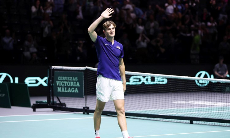 Jack Draper waves to the crowd after winning on his Davis Cup debut against Australia