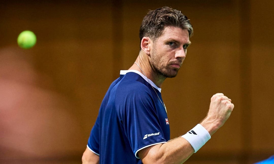 Cam Norrie gives a fist pump after winning a point in the Davis Cup against Poland