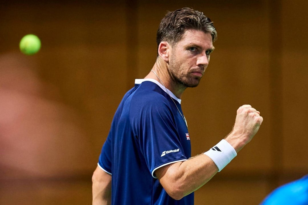 Cam Norrie gives a fist pump after winning a point in the Davis Cup against Poland