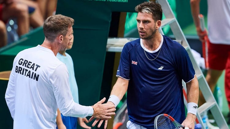 Cam Norrie and Leon Smith high five during GB's Davis Cup tie against Poland