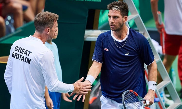 Cam Norrie and Leon Smith high five during GB's Davis Cup tie against Poland