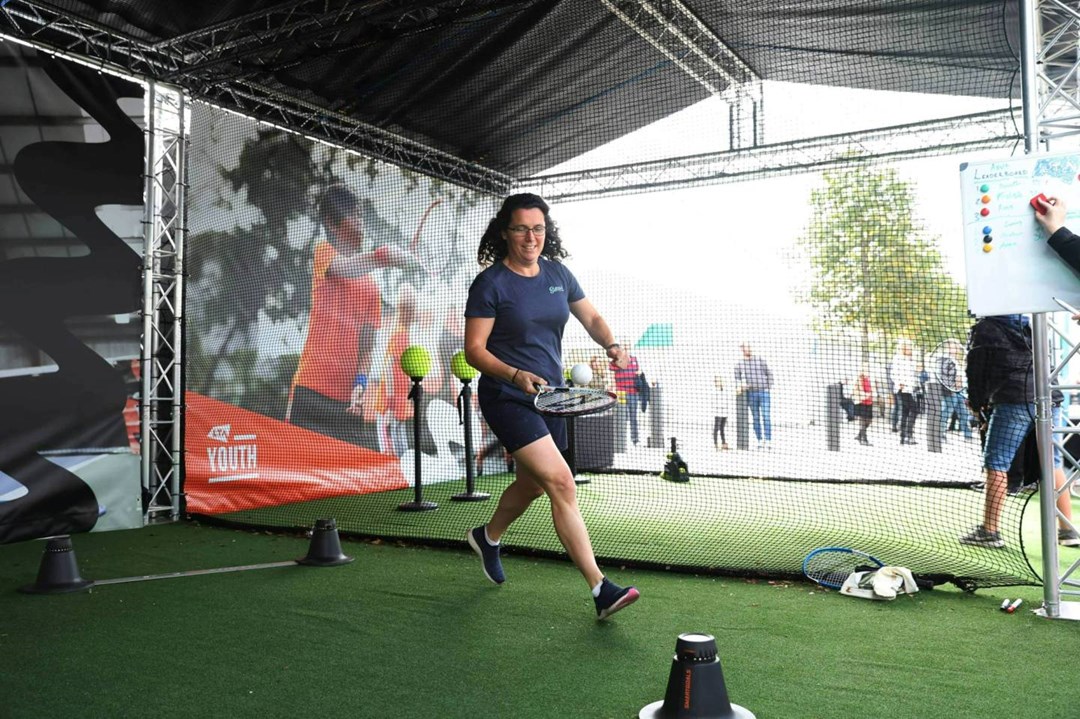 Woman playing tennis at the 2022 Davis Cup fan zone