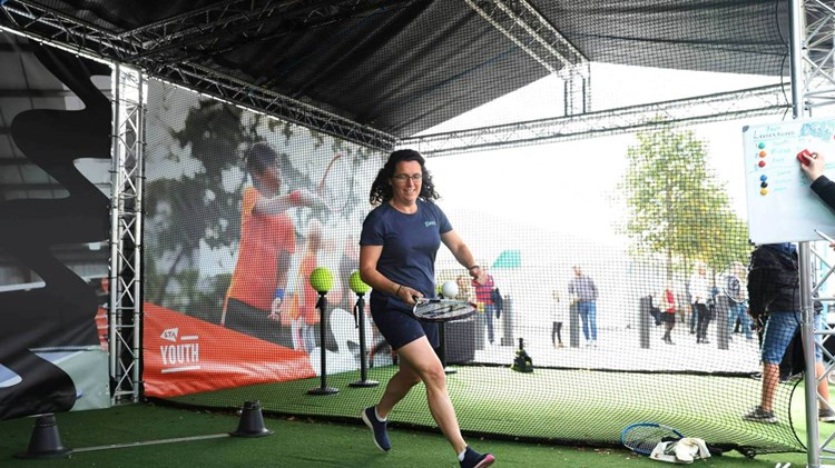 Woman playing tennis at the 2022 Davis Cup fan zone