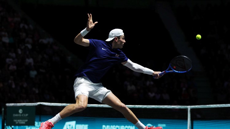 Jack Draper stretches for a backhand against Felix Auger-Aliassime at the Davis Cup
