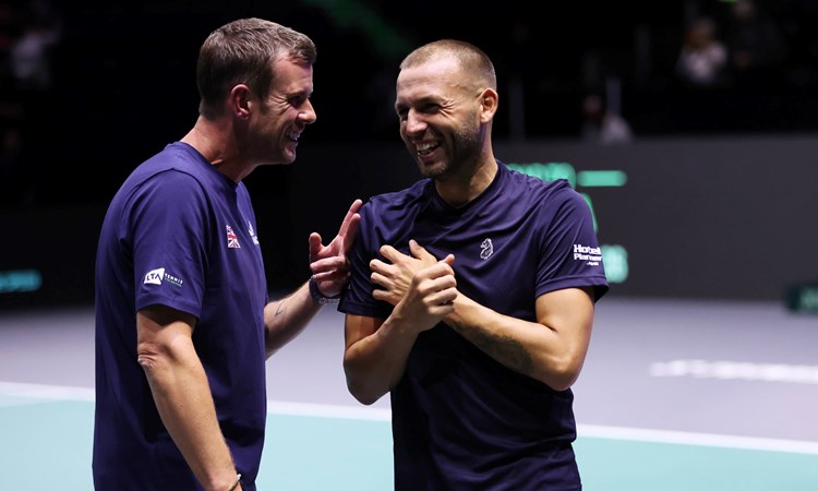 Leon Smith and Dan Evans laughing on court at the Davis Cup