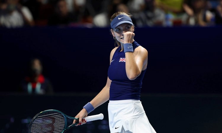 British tennis player Katie Boulter clenching her fist on court after winning a point during Great Britain's Billie Jean King Cup tie against Japan