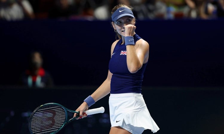 British tennis player Katie Boulter clenching her fist on court after winning a point during Great Britain's Billie Jean King Cup tie against Japan