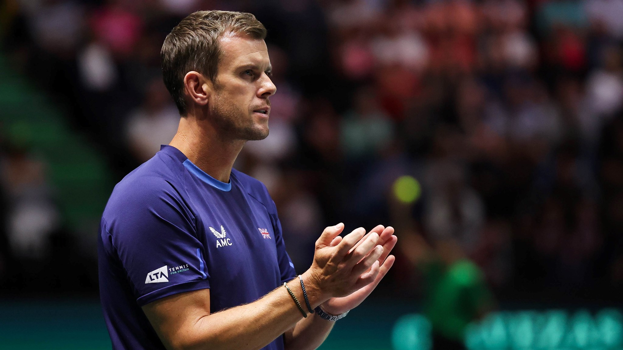 Leon Smith clapping on court at the 2023 Davis Cup Finals Group Stages