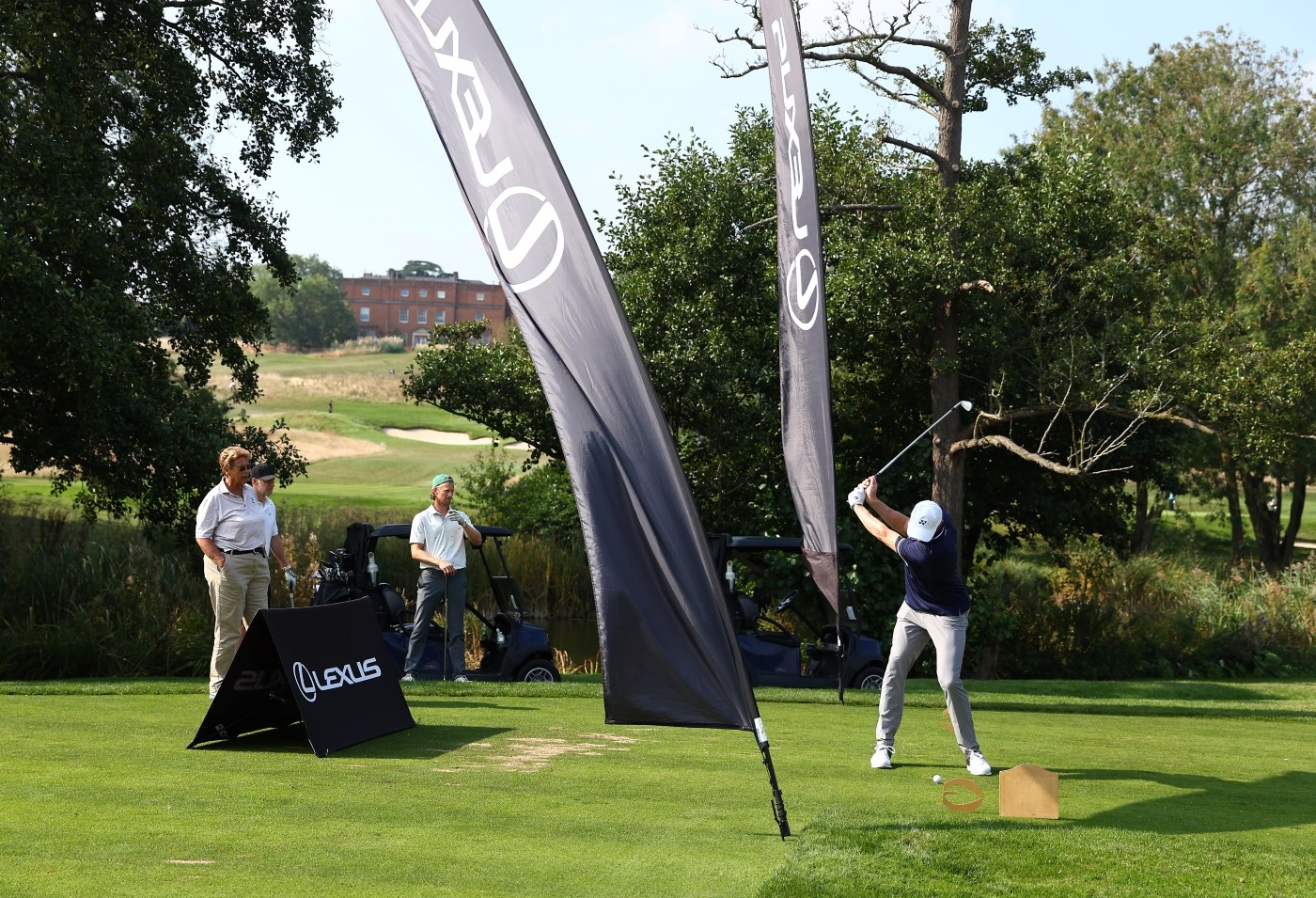 Billy Harris teeing off at Lexus hole LTA Tennis Foundation Golf Day