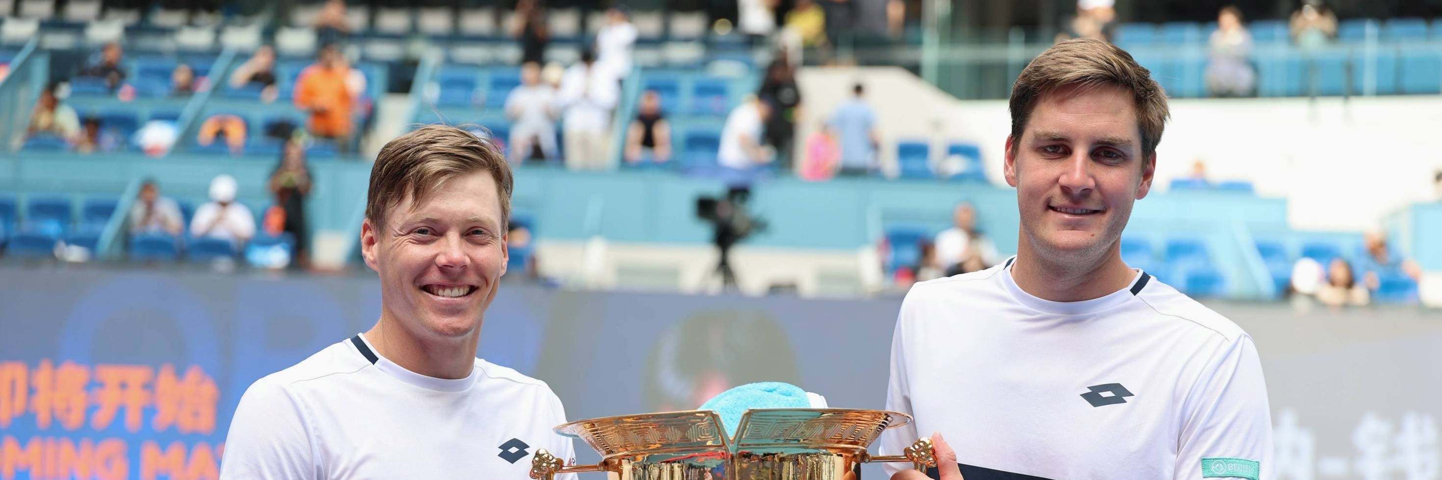 Henry Patten and Harri Heliovaara holding the China Open men's doubles title