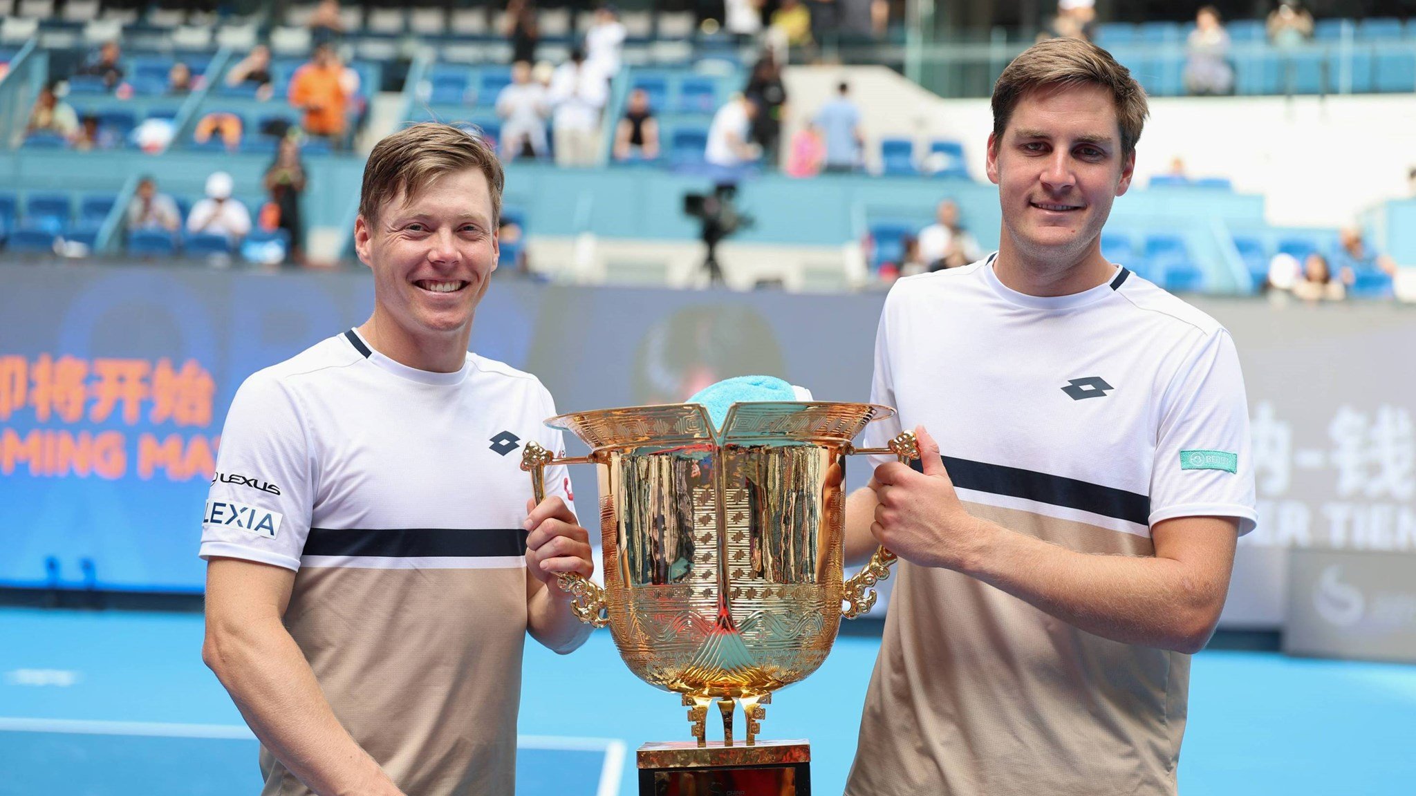 Henry Patten and Harri Heliovaara holding the China Open men's doubles title