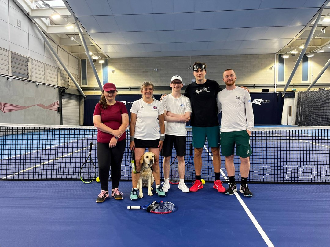 Jack Draper on court with some of the Visually Impaired GB players