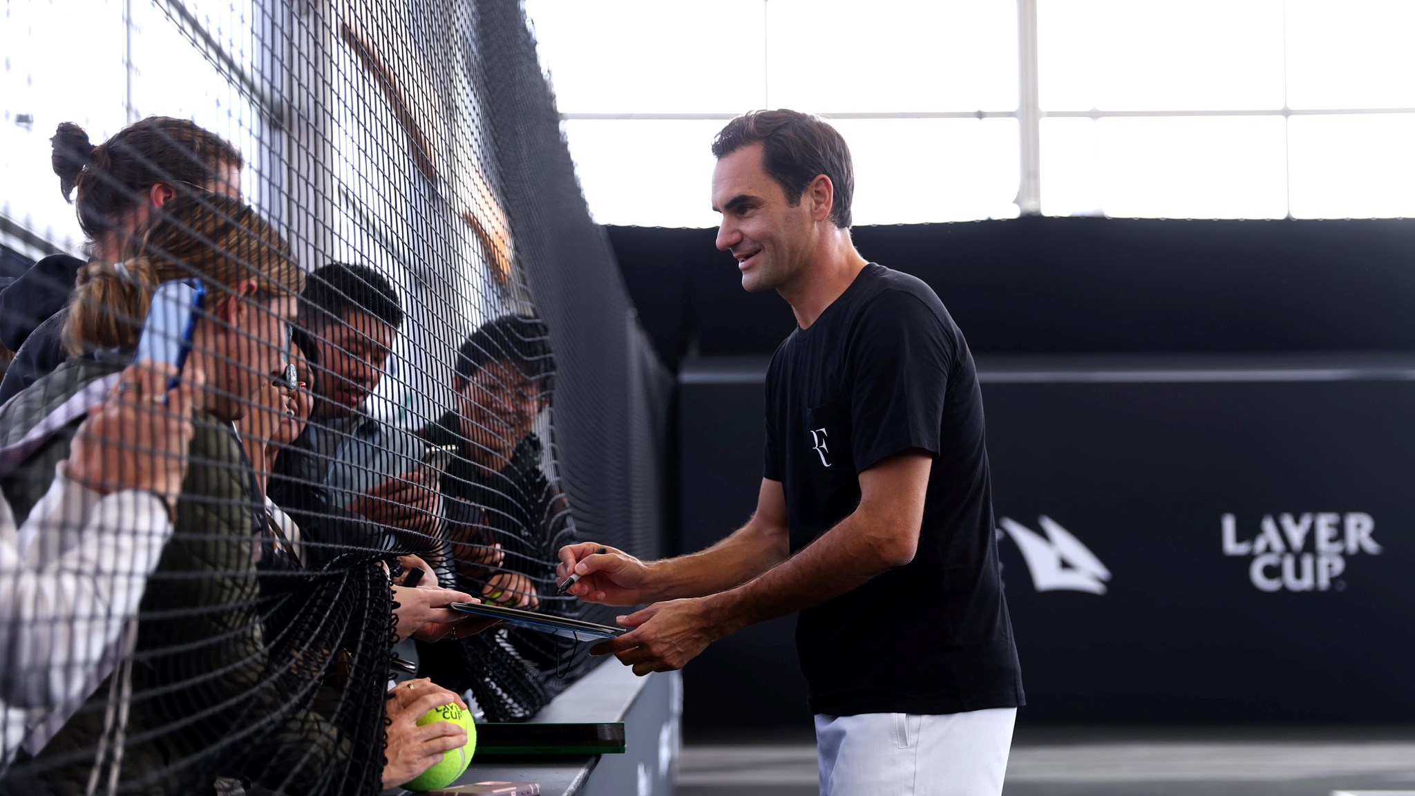 Roger Federer of Team Europe interacts with fans on the practice court ahead of the Laver Cup at The O2 Arena 
