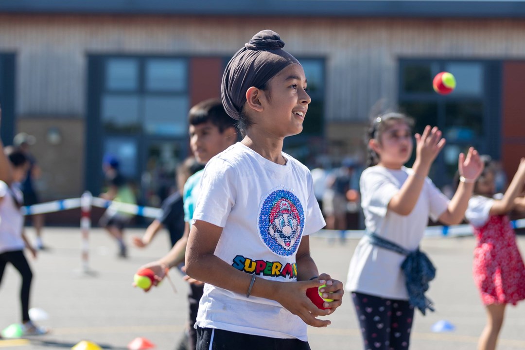 Child taking part in an LTA SERVES session