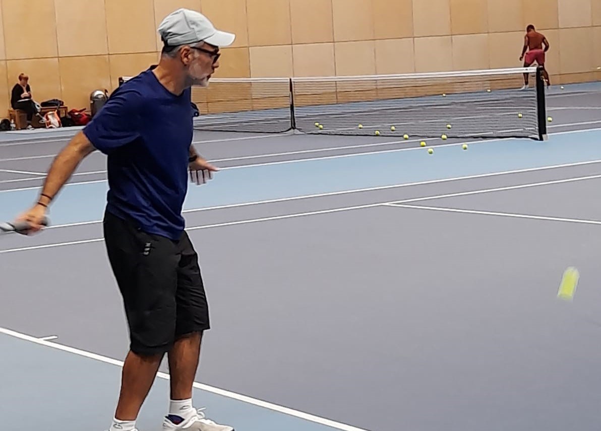 Player hitting the tennis ball at the Lee Valley Tennis Centre