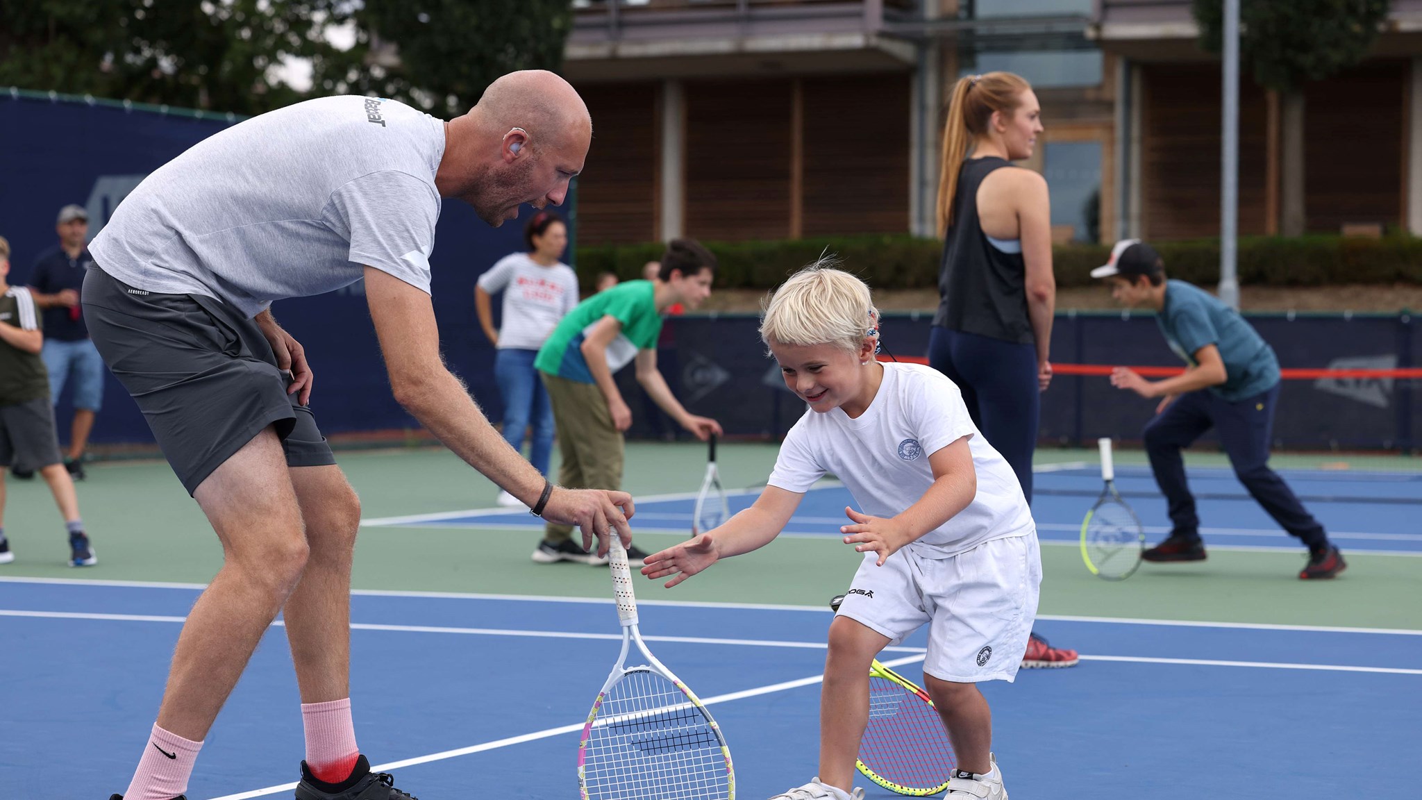 Lewis Fletcher getting involved with drills during the youth session at the Deaf Nationals festival 2022 at the National Tennis Centre