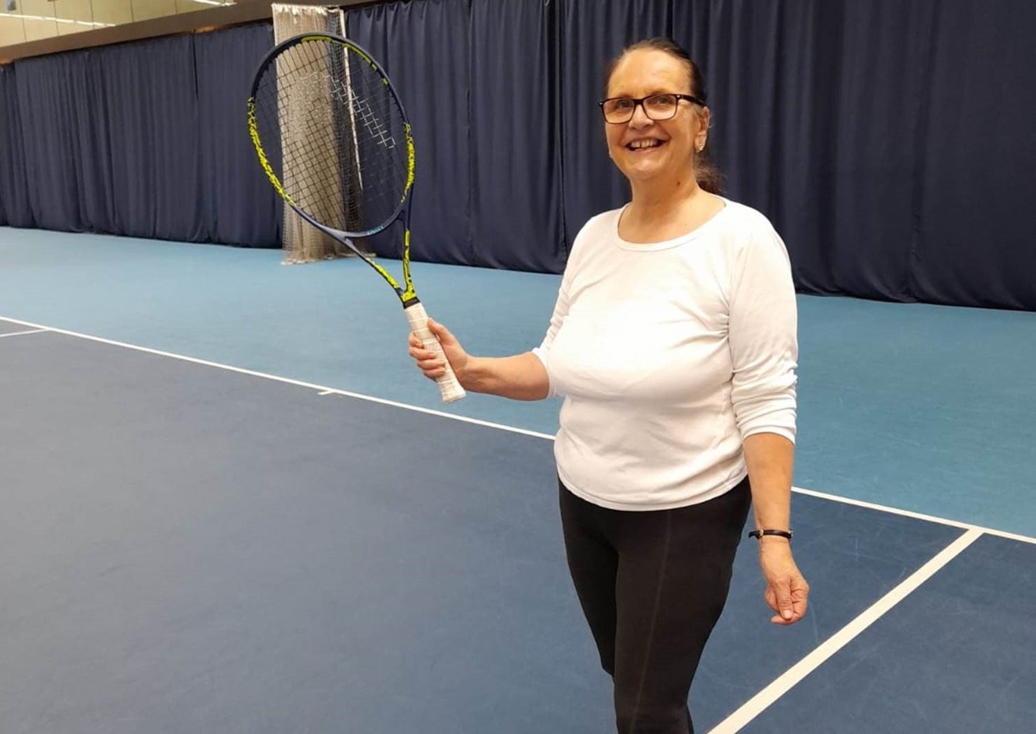 Tennis player holding a racket at the Lee Valley Tennis Centre