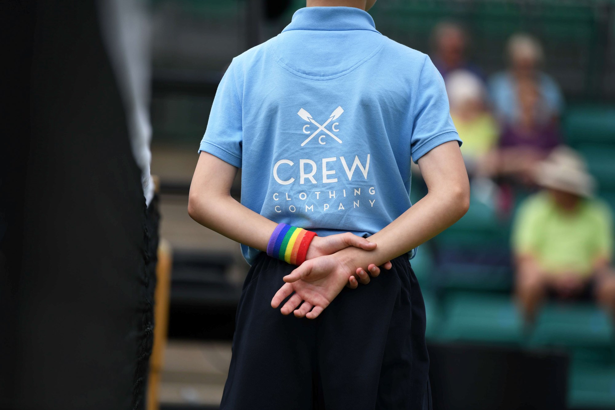 A crew member wearing a rainbow wristband in support of the LGBTQ+  Community during the summer events' Pride Days 