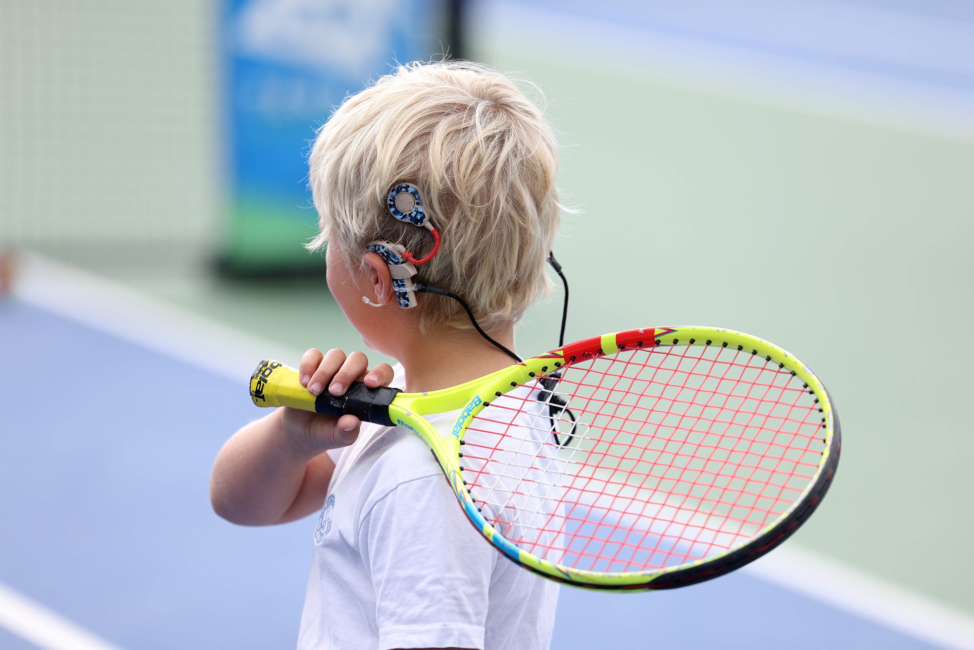 A young boy who wears a cochlear implant in action during the youth session at the Deaf Nationals Festival