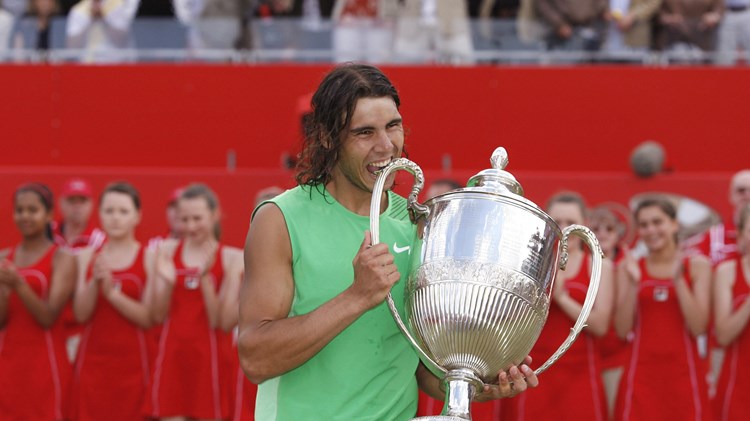 Rafael Nadal bites the Queen's Club trophy after beating Novak Djokovic in the 2008 final