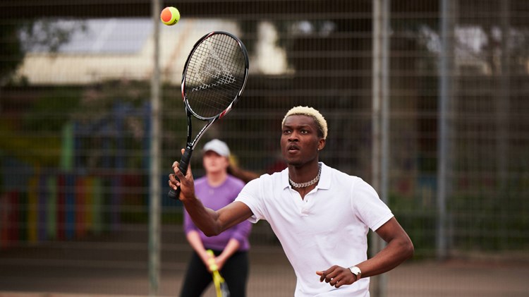 Tennis player on court ready for a volley