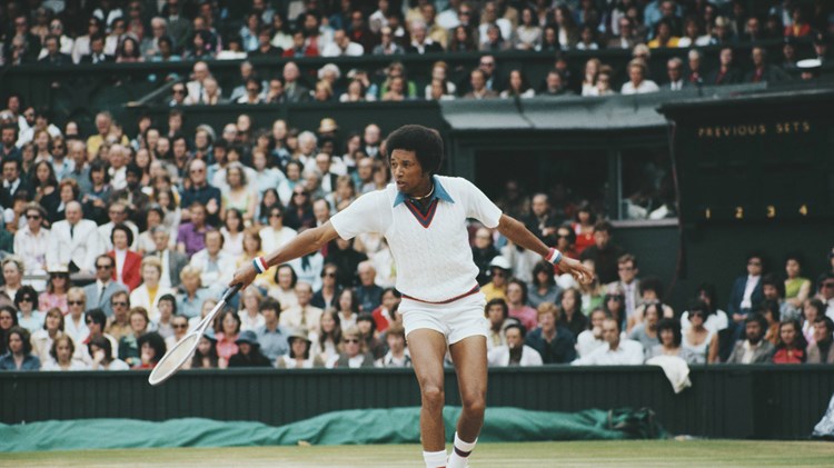Arthur Ashe hitting a backhand on Centre Court at Wimbledon
