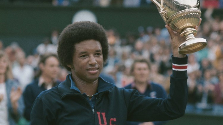 Arthur Ashe holding the Wimbledon men's singles trophy
