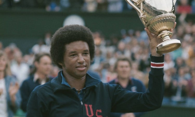 Arthur Ashe holding the Wimbledon men's singles trophy
