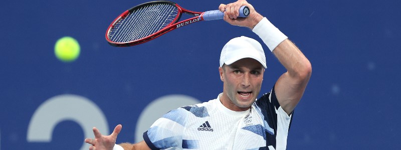 Liam Broady plays a forehand at the 2020 Olympics 