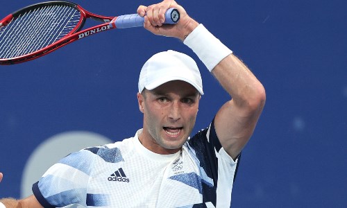 Liam Broady plays a forehand at the 2020 Olympics 