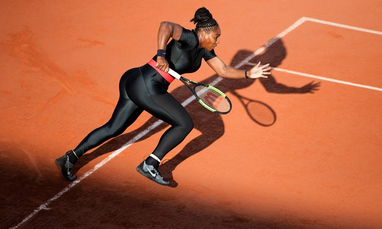 Serena Williams of the United States in action against Julia Goerges of Germany in the evening light on Court Suzanne Lenglen at the 2018 French Open