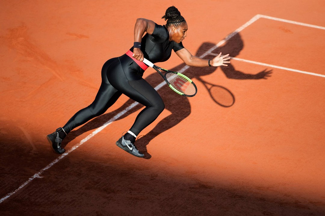 Serena Williams of the United States in action against Julia Goerges of Germany in the evening light on Court Suzanne Lenglen at the 2018 French Open
