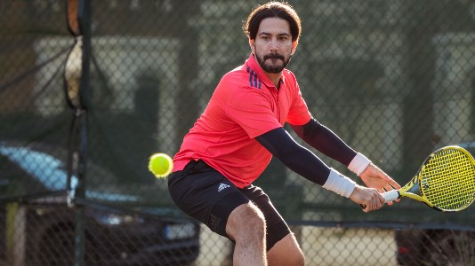 Player hits a backhand 