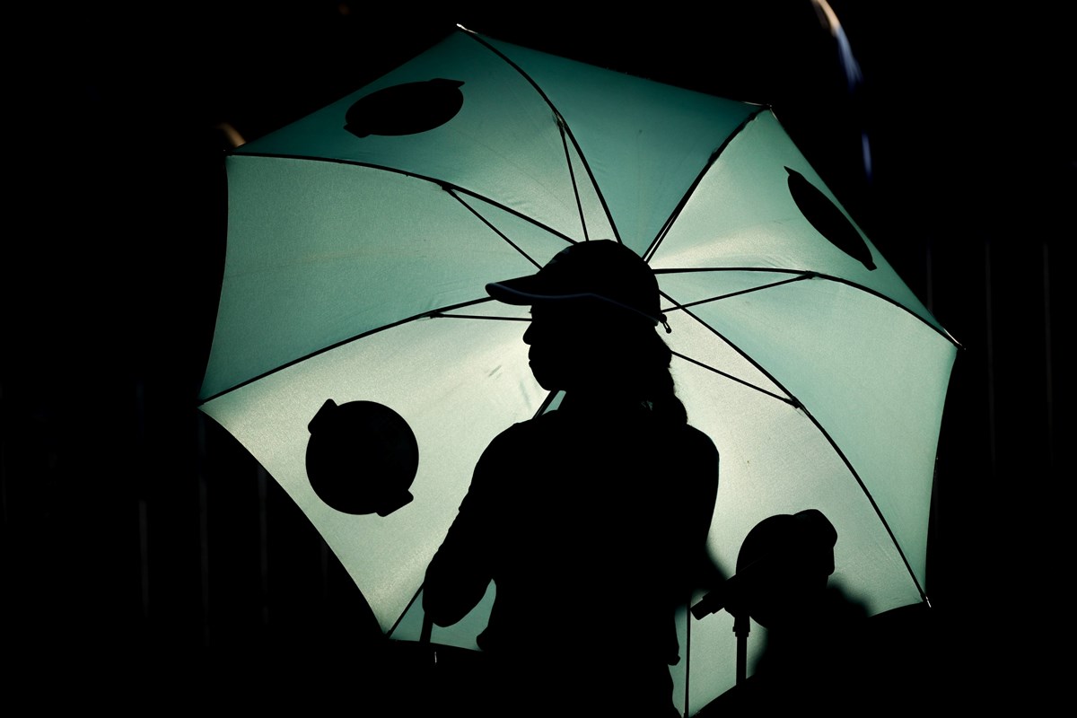 Ball-girl-holds-umbrella.jpg
