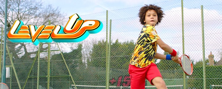 Child playing tennis with level up logo in picture