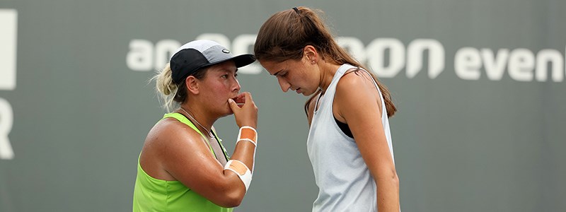 Tara Moore and Emina Bektas meet during their doubles match in Lexington