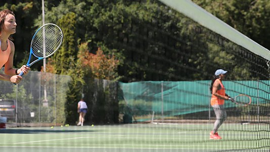 Women playing on outdoor court